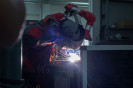 Professional welder,Welding automotive part in a car factory.